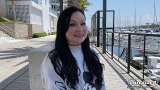 Tight and attractive Oriental web cam woman removes her coat